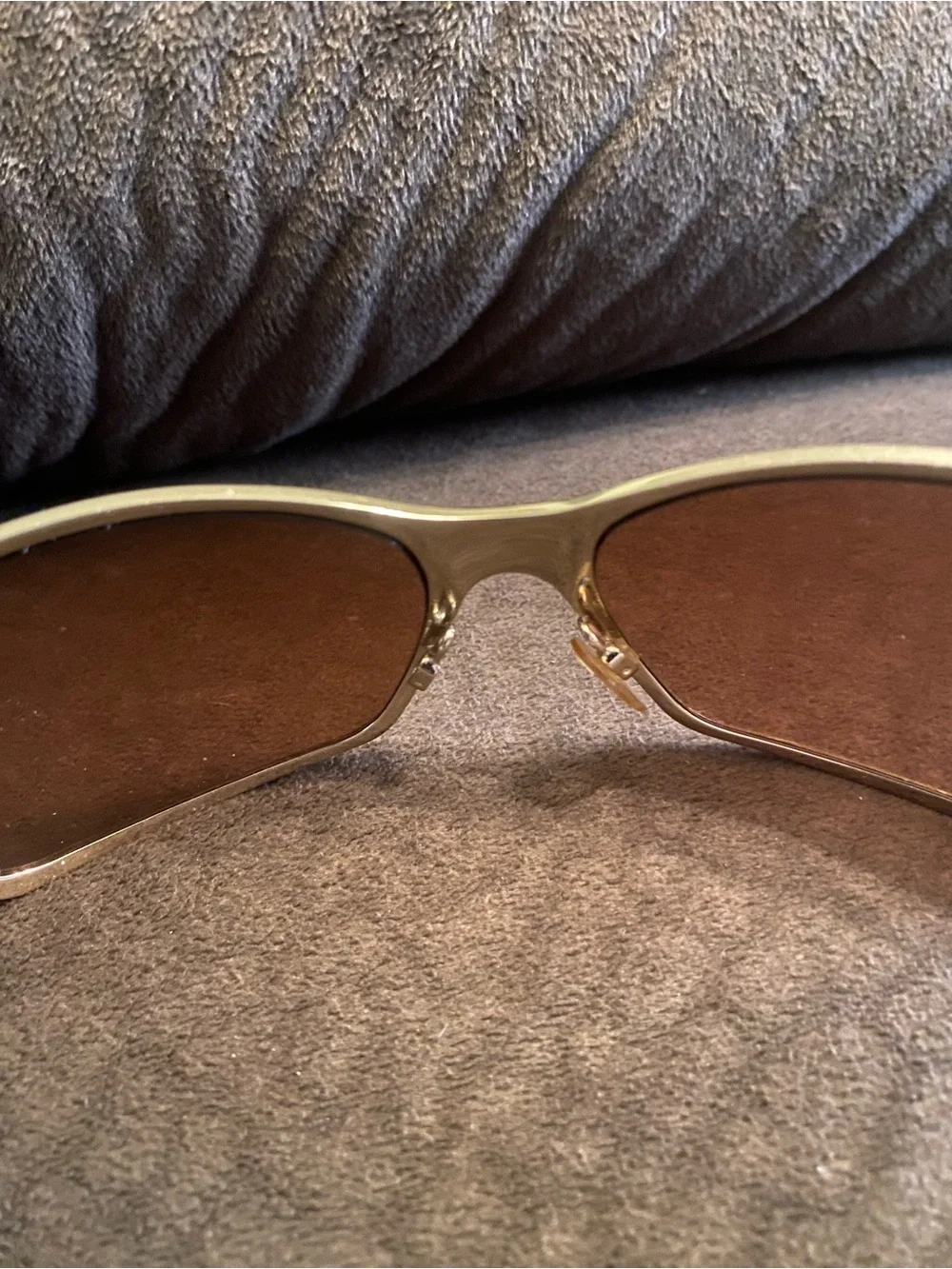 Oakley Silver Frame Sunglasses with Brown Lenses